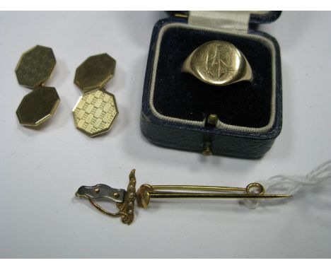 A Pair of 9ct Gold Gent's Cufflinks, of octagonal shape, with one engine turned panel, on chain connection, a gent's signet r
