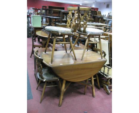 Ercol Drop Leaf Table, on four splayed legs, united by 'X' stretcher and four Fleur De Lys backed chairs. (5)