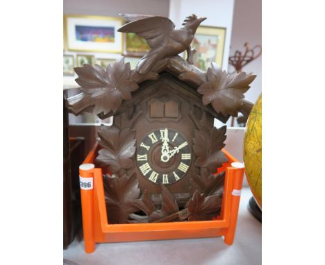 Beyer Uhren of Bonn Black Forest Style Cuckoo Clock, with three conifer weights.