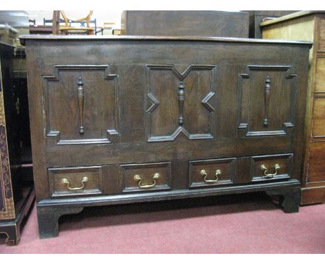 A XVII and Later Joined Oak Moulded Front Mule Chest, with a hinged lid, three panelled front with split balusters, two small