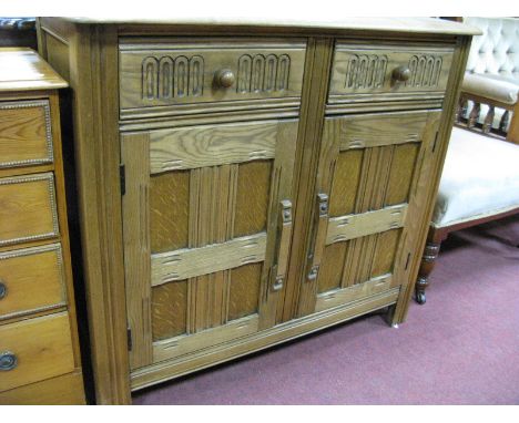 Ercol Style Stripped Oak Cupboard, with two knulled drawers over lattice cupboard doors 91.5cm wide.