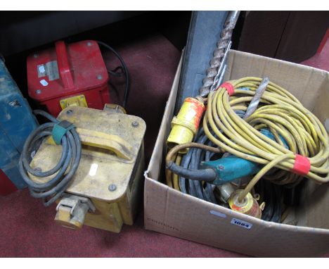 A Makita 110 volt Hammer Drill (cased), two transformers, cables, angle grinder, drill bits etc