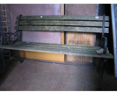 A Two Seater Garden Bench, cast iron scrolled ends.
