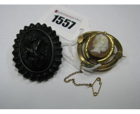 A Victorian Style Oval Jet Coloured Brooch, of floral design, within textured border, a vintage shell carved cameo brooch, de