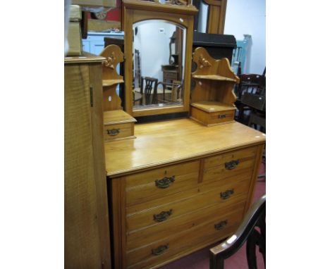 An Early XX Century Satin Walnut Dressing Table, with a central mirror, jewel drawers, two short drawers, two long drawers, o