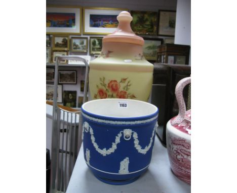 A Wedgwood Co Ltd Jasperware Planter, decorated with figures beneath grape and vine swags and lion mask and a large tinted gl