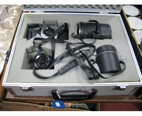 A Chinon C.S. Film Camera, in a Hakuba hard protective flight case; fitted with Auto Chinon f =135mm lens, f =28mm, auto flex