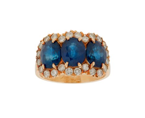 A sapphire and diamond set cluster ring claw set with three oval-cut sapphires in a border of round brilliant-cut diamonds, t