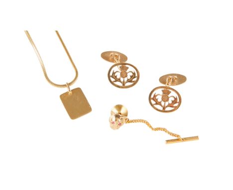 A pair of 9ct gold cufflinks the principal terminals with pierced thistle design; together with a tie-stud modelled as a leop