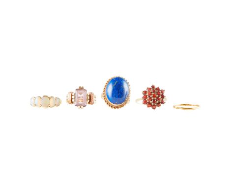 A collection of gem-set rings to include a 9ct gold ring set with an oval lapis lazuli cabochon in a rope twist border; toget