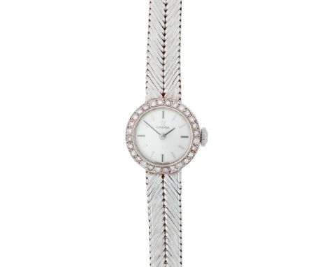 A lady's 18ct white gold diamond cocktail watch, Omega mid 20th century, silvered dial with applied baton hour markers, some 