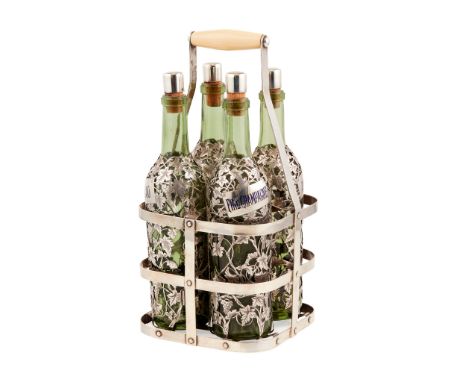 Y A Late 19th/ early 29th century French silver overlaid decanter set with four green glass bottles with grape vine overlay v