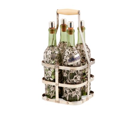 Y A Late 19th/ early 29th century French silver overlaid decanter set with four green glass bottles with grape vine overlay v