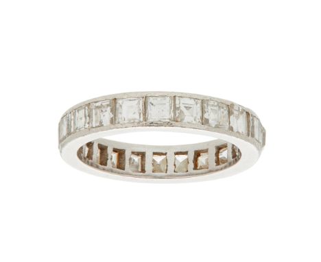 A diamond set eternity ring channel set with a continuous row of square step-cut diamonds, unmarked(Ring size: Q)
