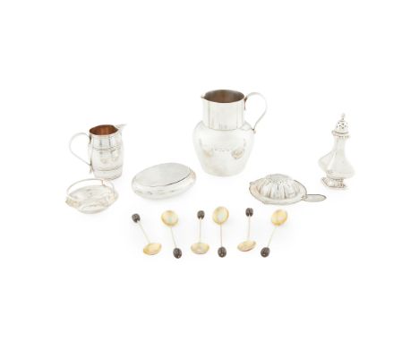 A collection of silver to include a jug, Charles Edwards, London 1908; a tea strainer, Sheffield; a collection of coffee bean