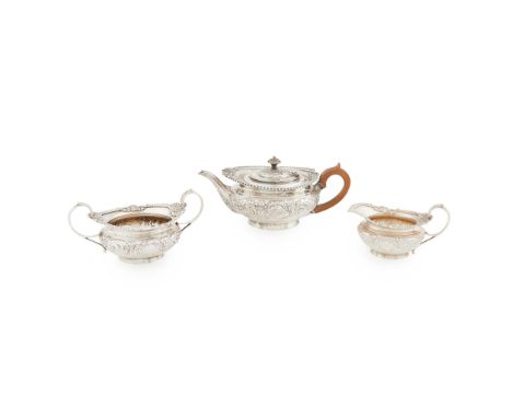 An Edwardian three piece tea service retailed MacKay &amp; Chisolm (Edinburgh) London 1905, comprising teapot, twin handled s