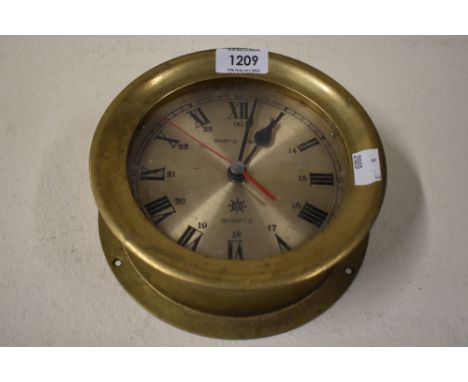 A reproduction brass cased nautical ships style clock