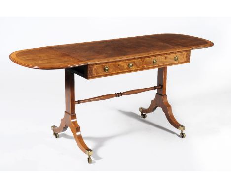 A George III mahogany and satinwood crossbanded sofa table, circa 1790, the rectangular twin flap top above a frieze drawer a