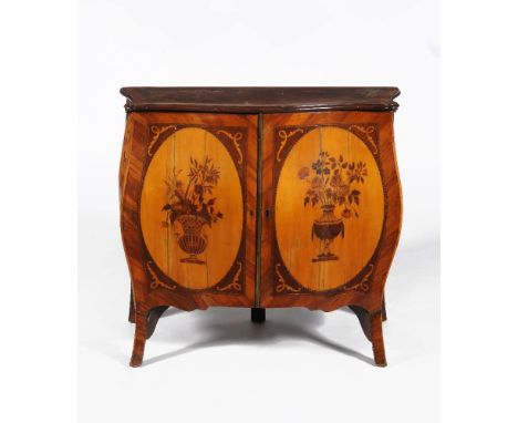 A George III satinwood, tulipwood and marquetry serpentine commode, circa 1770, in the manner of John Cobb, the shaped top de