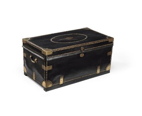 A Chinese export leather and brass studded trunk, 19th century, with camphor lined interior, the top centred by a plain oval 