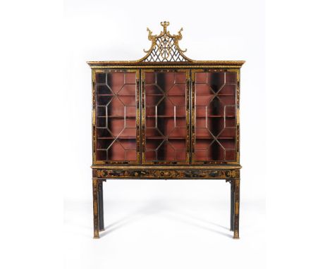 A black lacquer and gilt chinoiserie decorated cabinet in George III style, first quarter 20th century, decorated overall wit