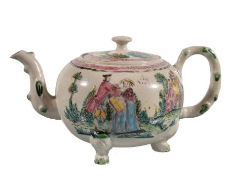 A Staffordshire salt-glazed stoneware teapot and cover, mid 18th century, painted in colours with European figures in a lands