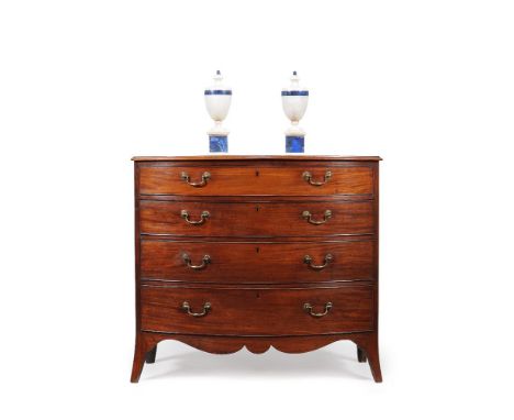 A George III mahogany bowfront chest of drawers, circa 1790, the shaped top with moulded edge, above four long graduated draw