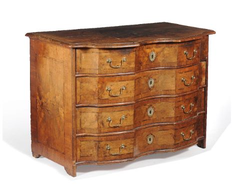 A Continental walnut serpentine fronted commode, mid 18th century, the shaped banded and figured top above four long crossban