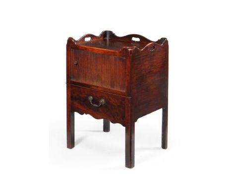 A George III mahogany tray top night commode, circa 1780, the rectangular top with a shaped gallery incorporating pierced car