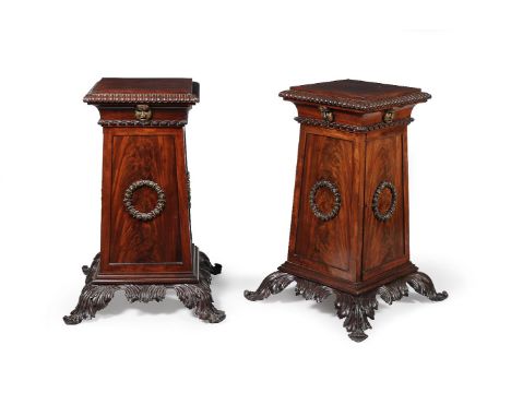 A pair of Regency mahogany pedestals, circa 1815, each of square section with lobed border above tapering bodies with applied