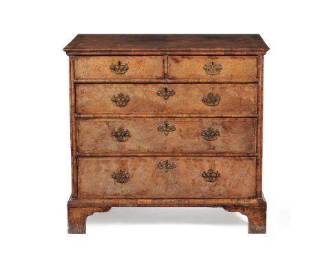 A William III walnut and feather banded chest of drawers, circa 1700, the quarter veneered top with moulded edge, above two s