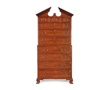 A George III mahogany chest on chest, circa 1770, the 'swan neck' pediment with greek key moulding, above three short and sev