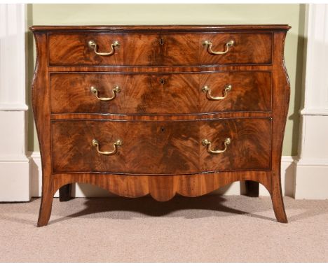 A George III mahogany serpentine commode, circa 1770, attributable to Henry Hill of Marlborough, the crossbanded and moulded 
