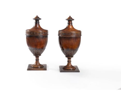 A pair of mahogany knife boxes, in George III style, late 19th/early 20th century, modelled as urns, each top with blind fret