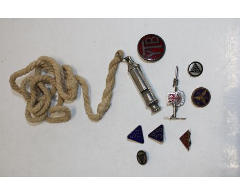 A girl guides whistle and vintage badges 