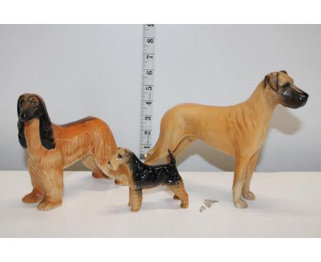 Three vintage dog ornaments, smaller dog has had one leg re-attached 
