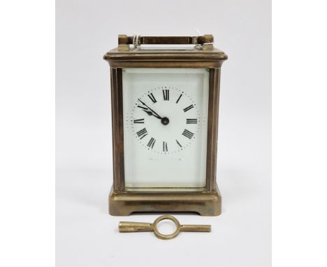 French gilt brass cased carriage clock, with bevelled edge glass panels, the white enamel face with Roman numerals, the movem