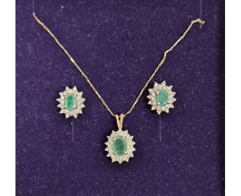 9K gold, emerald and diamond suite&nbsp;viz:- emerald and diamond cluster pendant set centre facet-cut oval emerald and surro