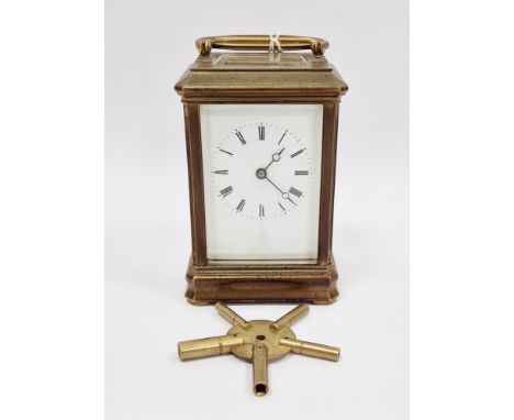 Late 19th century French gilt brass cased chiming carriage clock, with bevelled edge glass panels, the white enamel face with