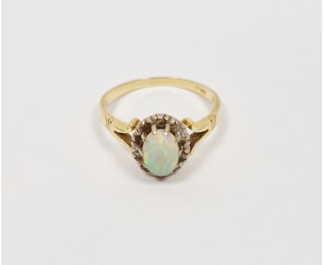 Gold-coloured metal, opal and white stone ring&nbsp;set oval opal surrounded by small white stones (unmarked)&nbsp;Condition 