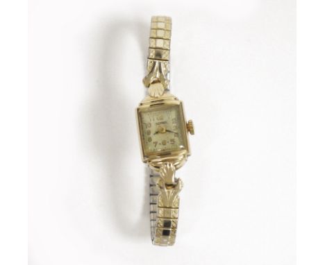 Bernex lady's 9ct gold cased manual wind wristwatch, the rectangular dial having Arabic numerals denoting hours, on expanding