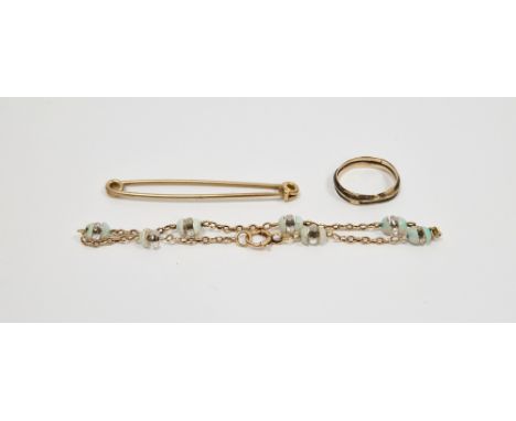 9ct gold safety pin style brooch, 5.5cm long, 3.1 grams together with an antique yellow metal band and a yellow metal oval li
