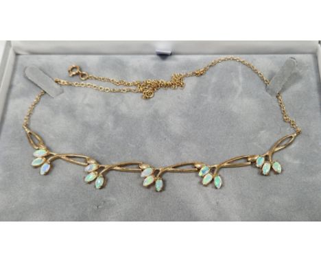 Modern 9ct gold and opal necklace having five sprays of triple opals, on integral fine chain  Condition Report Approx weight 