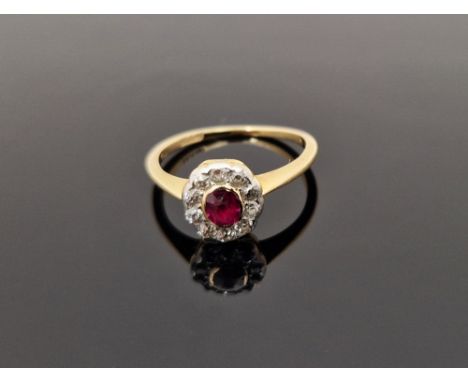 18ct gold, diamond and ruby ring set small oval ruby surrounded by old cut diamonds (some wear)&nbsp;