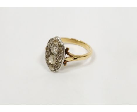 18ct gold and diamond dress ring, elliptical, set old cut stones, the two centre cushion-shaped each approx. 0.25ct (size K)