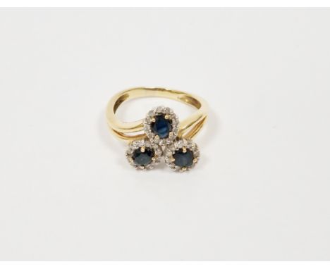 18ct gold, sapphire and diamond triple cluster ring set three sapphires surrounded by small diamonds (size O)Condition Report
