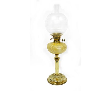 Late 19th / early 20th century brass oil lamp, with opaque globular etched glass shade depicting swans amongst foliage on a r