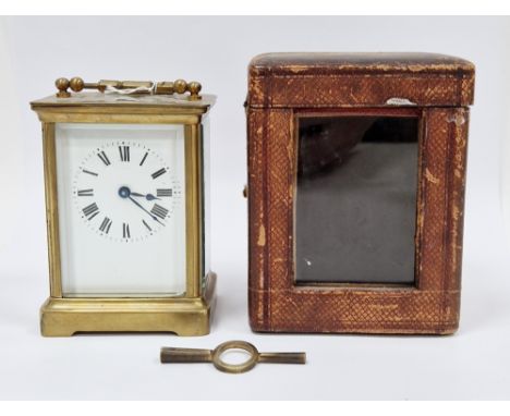 Late 19th / early 20th century gilt brass cased carriage clock with bevelled glass panels, the white enamel face with Roman n