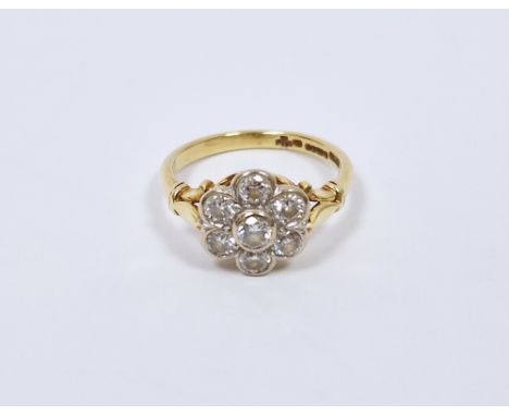 1920&rsquo;s 18ct gold, platinum and diamond cluster ring set seven stones in flowerhead settings (size P)&nbsp;Condition Rep