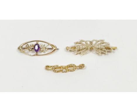 Gold-coloured metal and seedpearl small loop and flowerhead brooch, a gold, amethyst and seedpearl oval bar brooch,&nbsp;and 